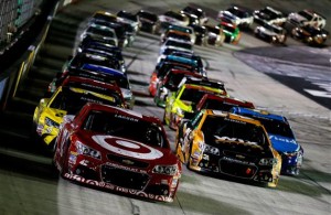 Kyle Larson leads the field in a restart during the 2015 NASCAR Sprint Cup Series Food City 500 at Bristol Motor Speedway. [Credit: Todd Warshaw/NASCAR via Getty Images]