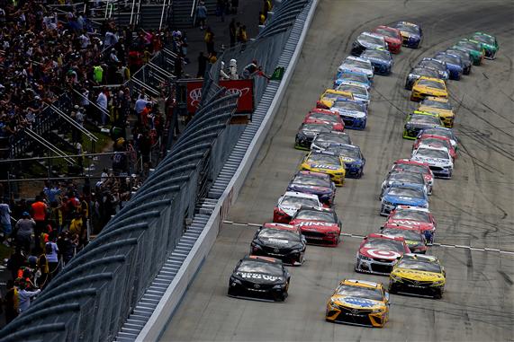 Kyle Busch and Martin Truex Jr. lead the field to start the Monster Energy NASCAR Cup Series AAA 400 Drive for Autism in June at Dover International Speedway. [Photo by Chris Trotman/Getty Images]