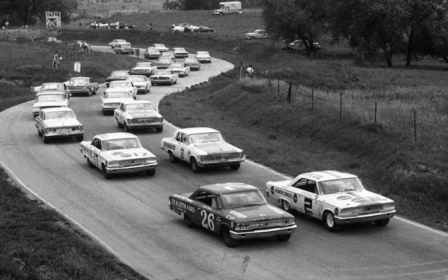 The field is lined up ready to go at Meadowdale for the scheduled 250-mile USAC Stock Car race. Row one has the 1963 Fords of Don White #2 and Curtis Turner #26. Row two is occupied by Norm Nelson #3 and Harry Heuer #17. [Photo by Russ Lake]