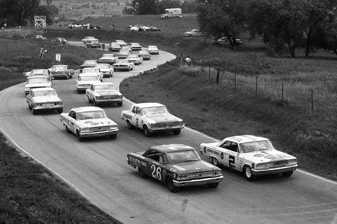 The field is lined up ready to go at Meadowdale for the scheduled 250-mile USAC Stock Car race. Row one has the 1963 Fords of Don White #2 and Curtis Turner #26. Row two is occupied by Norm Nelson #3 and Harry Heuer #17. [Photo by Russ Lake]