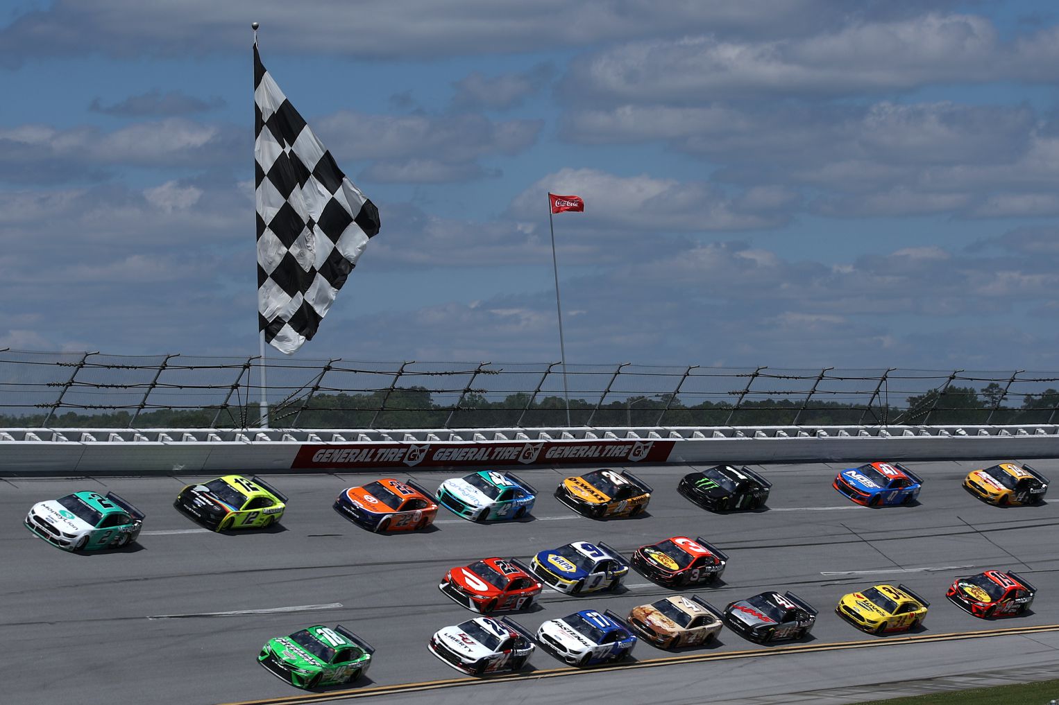 Brad Keselowski, Kyle Busch and Ryan Blaney race during the NASCAR Cup Series GEICO 500 at Talladega Superspeedway. (Photo by Sean Gardner/Getty Images)