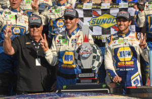 Winner's circle with owner Rick Hendrick, crew chief Alan Gustafson and winner Chase Elliott. All three ar holding up two fingers in celebration of 2nd consecutive win at Watkins Glen. [Joe Jennings Photo]