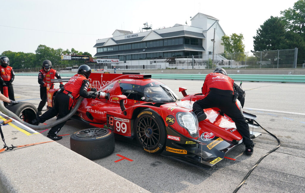 Pit action with the Media Center in the background. [Photo by Jack Webster]