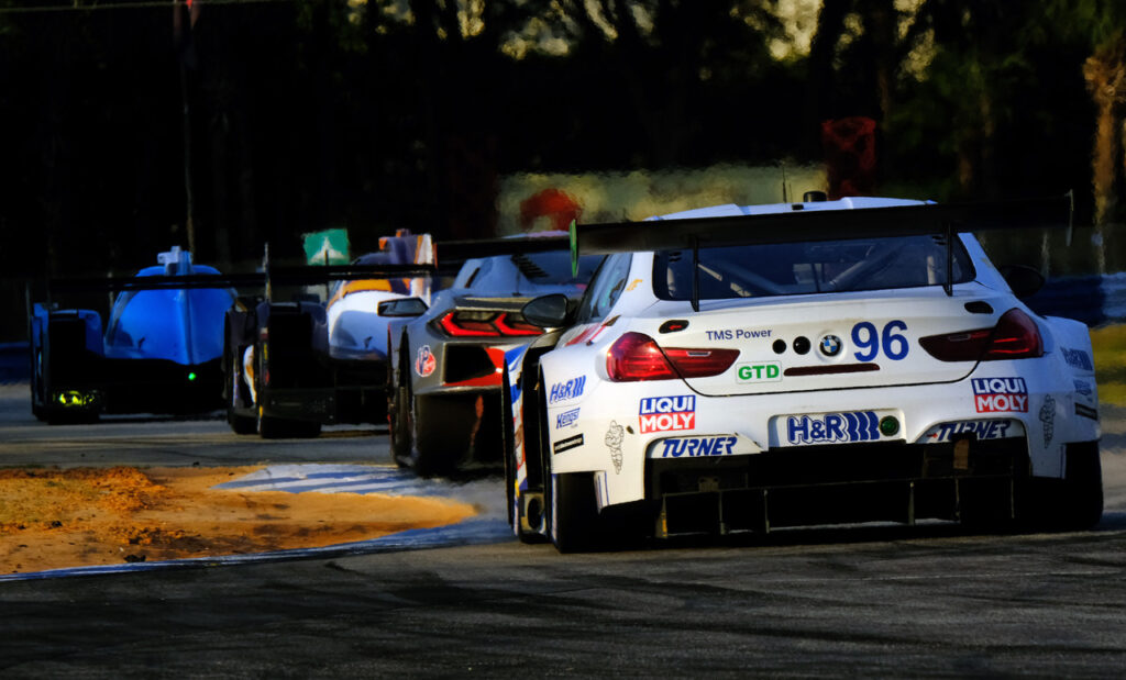 Race action exiting the hairpin. [Jack Webster Photo]