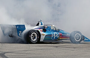 Josef Newgarden celebrates a $1 million win at Road America. [Pete Gorski photo]