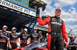 Will Power celebrates his pole win for the GMR Grand Prix at the Indianapolis Motor Speedway road course. [Media Credit Penske Entertainment: Aaron Skillman]